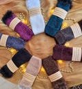 Luxuriously soft hand-knitted wrist warmers made with shimmering mohair yarn